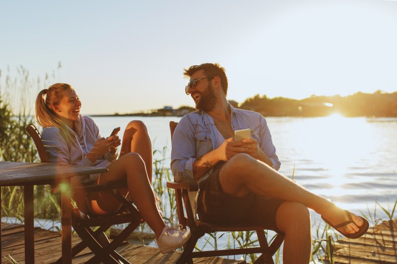 Couple smiles at beach